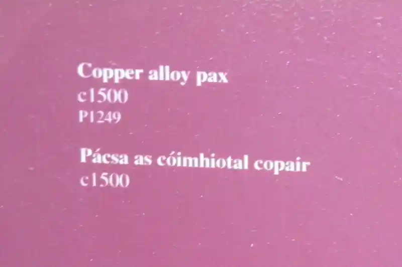 T-shaped cross crucifix on a copper sheet